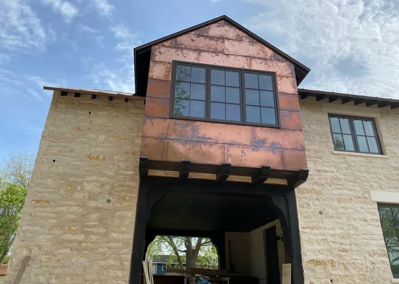 Copper metal panel facade on a stone building for Skylight Installation in Lithia Springs