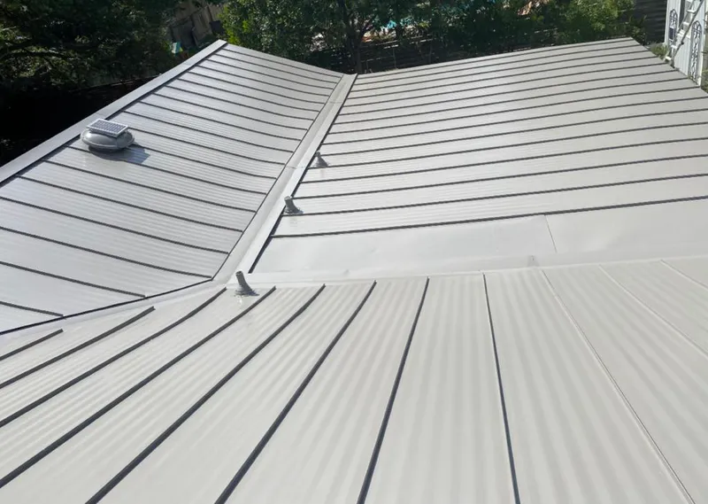 Solar attic fan installed on a metal roof for Roof Ventilation in Lithia Springs
